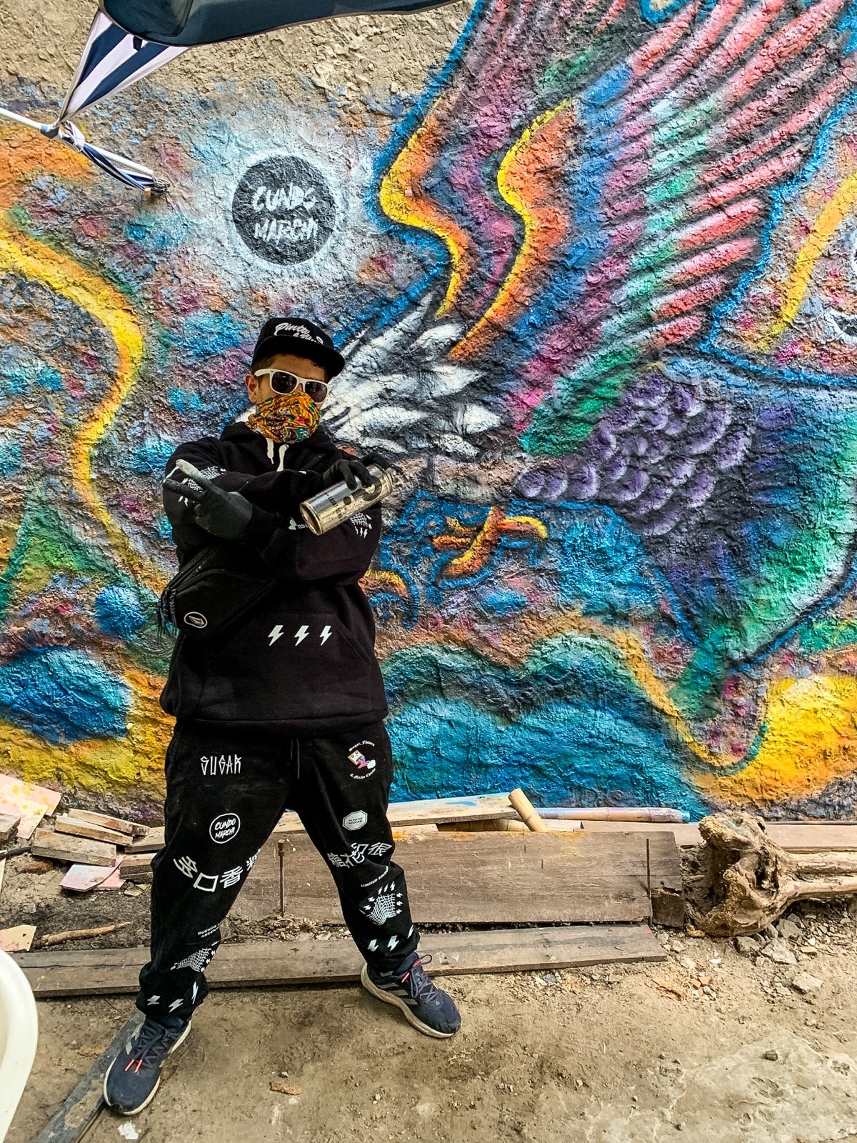 Cundo Marchi in front of the Eagle mural