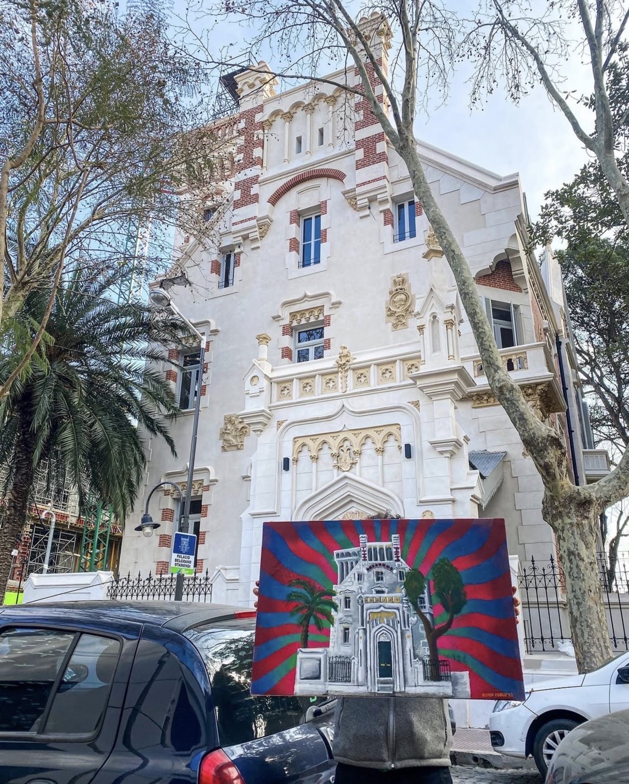 Cundo Marchi with the finished piece, Otamendi Palace behind